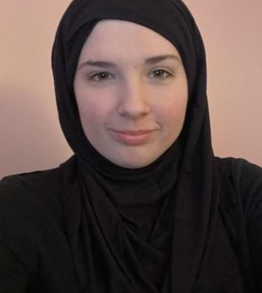 woman in black with head scarf