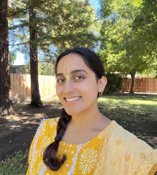 Woman in yellow dress on lawn