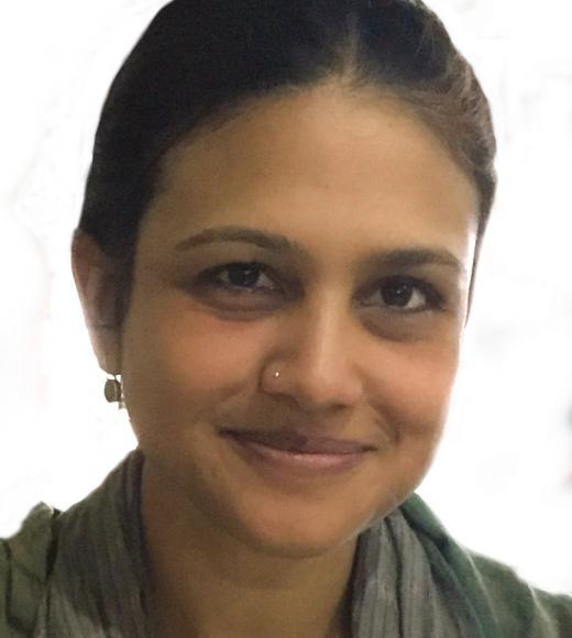 A woman smiling at the camera