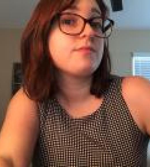 picture of brown haired woman with glasses