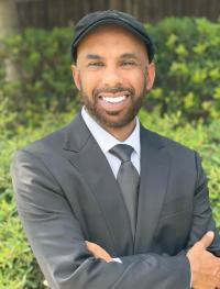 Man in suit and pageboy hat