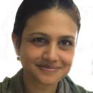 A woman smiling at the camera