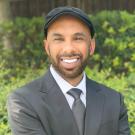 Man in suit and pageboy hat