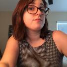 picture of brown haired woman with glasses